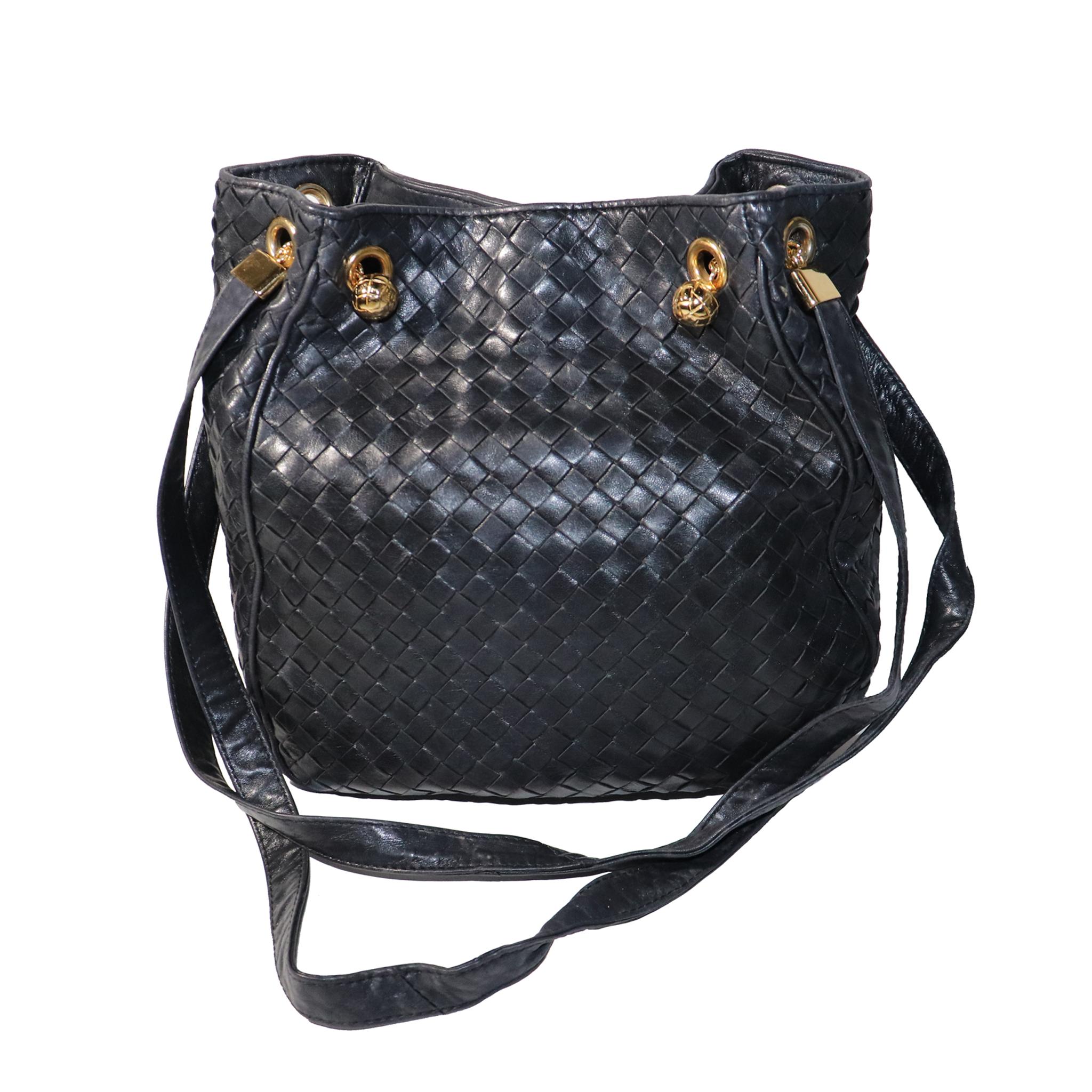 Bottega Veneta Black Classic Woven Bucket Shoulder bag W/ Gold Accents. 
Coated leather lining is dry with some flaking, otherwise woven leather exterior is in near perfect condition. 

Measurements: 

Height - 10.5 inches 
Width - 9 inches 
Height