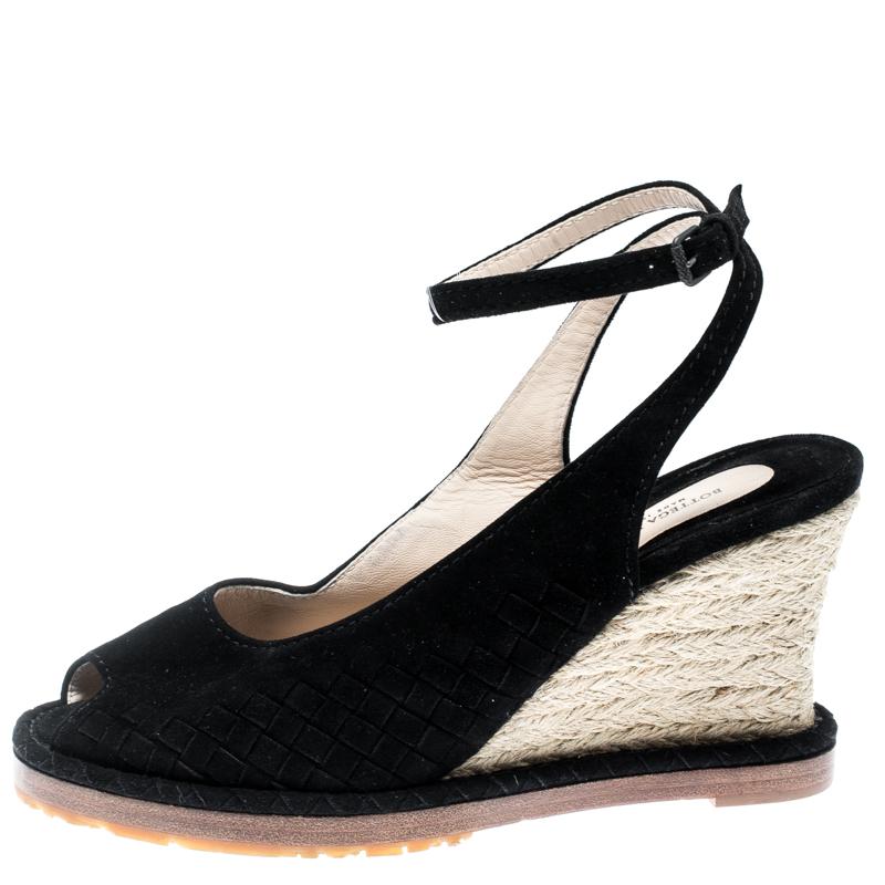 These Bottega Veneta wedge sandals will bring you the perfect amount of style and comfort. They are woven from suede in their Intrecciato pattern and feature ankle straps, peep toes, and espadrille wedge heels. They are lovely and easy to flaunt.

