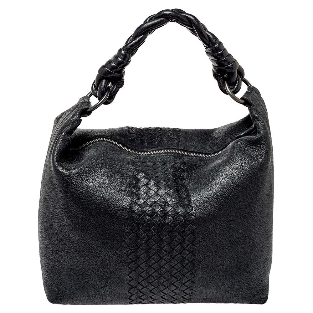 Masterfully crafted from leather & intrecciato leather, this bag can easily hold more than just essentials. This exquisitely designed bag can hold further than just essentials in its suede-lined interior. This handbag from Bottega Veneta will