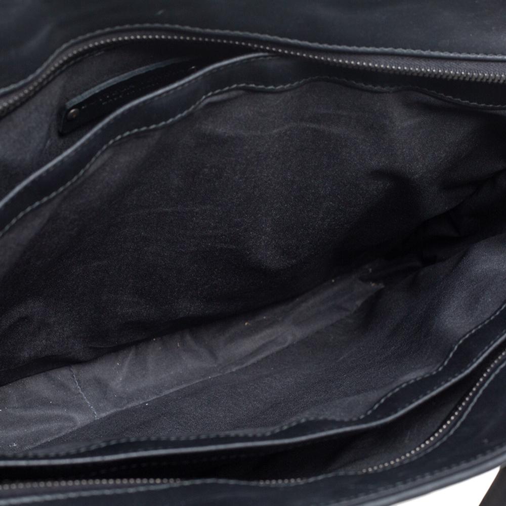 Well-made leather products are not only a symbol of style but also reliability. Crafted from leather, this briefcase by Bottega Veneta features top handles and a zip that opens up to reveal a spacious interior perfectly sized to carry your laptop,