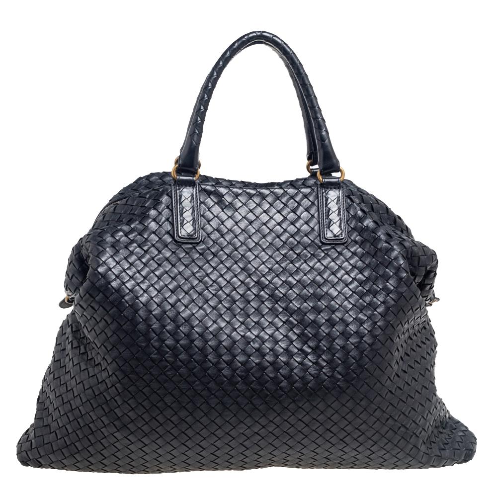 This Bottega Veneta creation is a tote that brings joy to one's sight! It has been beautifully crafted from leather and designed in the signature Intrecciato pattern, whilst being held by two top handles and a shoulder strap. The bag is also
