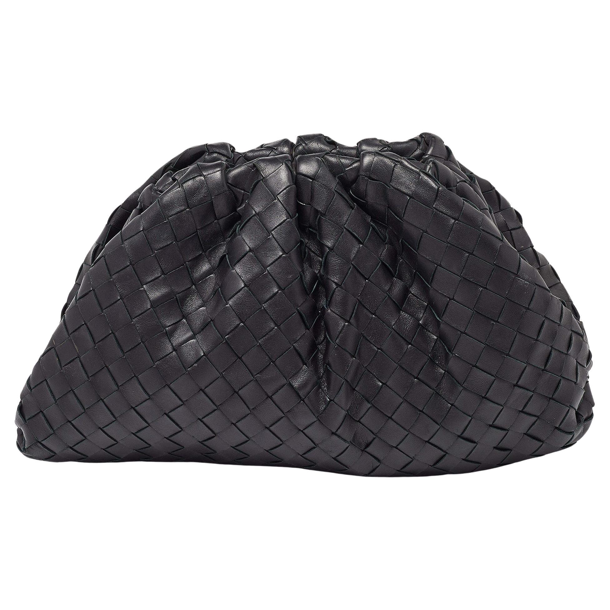 A bag that took the fashion world by storm, Bottega Veneta’s The Pouch clutch reflects Daniel Lee’s distinctive style choices. This version is skillfully made from black leather into an unstructured silhouette, providing ample space. Get ready to