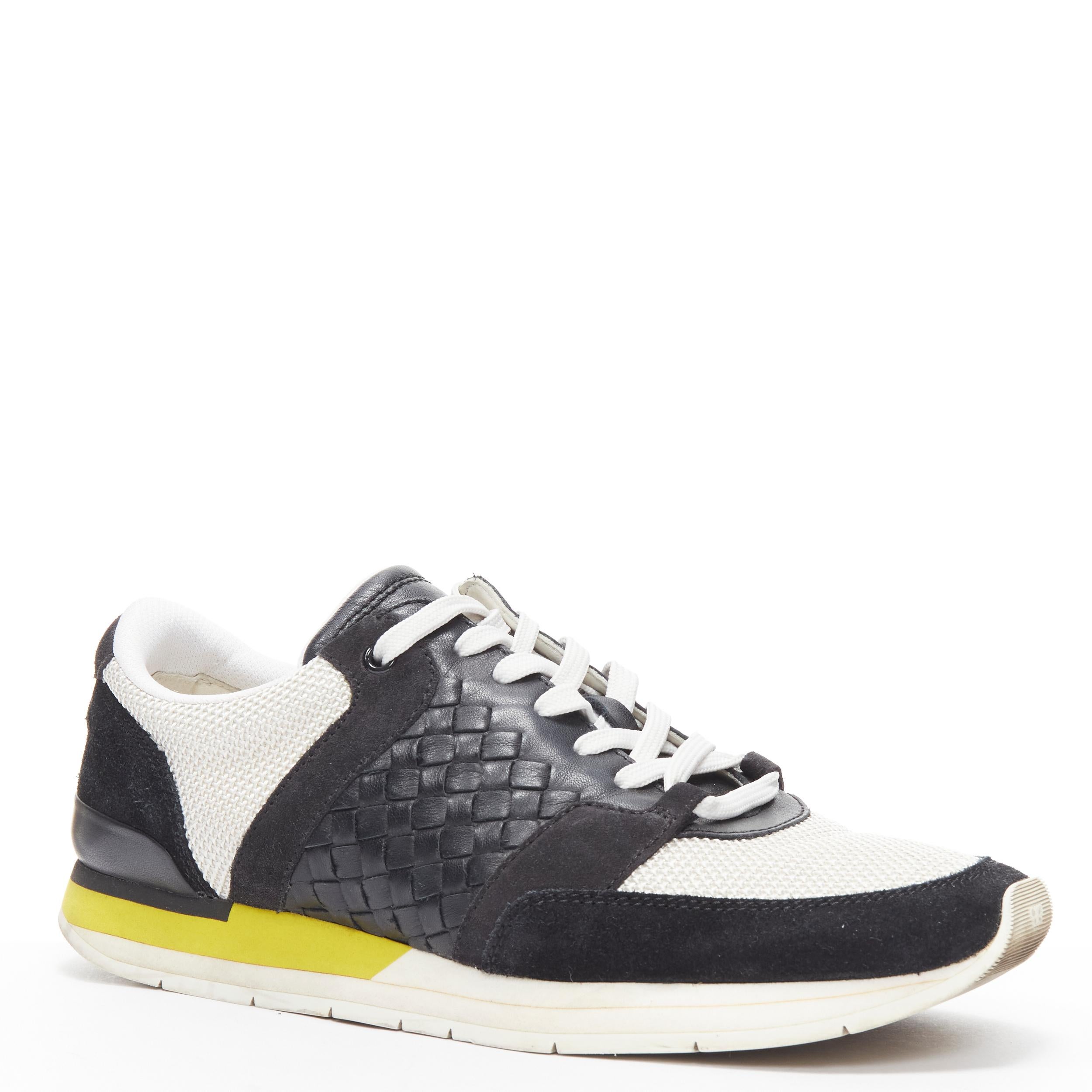 BOTTEGA VENETA black Intrecciato leather white yellow sole runner sneaker EU41 
Reference: LNKO/A01836 
Brand: Bottega Veneta 
Designer: Tomas Maier 
Material: FabricMesh 
Color: Black 
Closure: Lace Up 
Extra Detail: Woven leather detailing on side