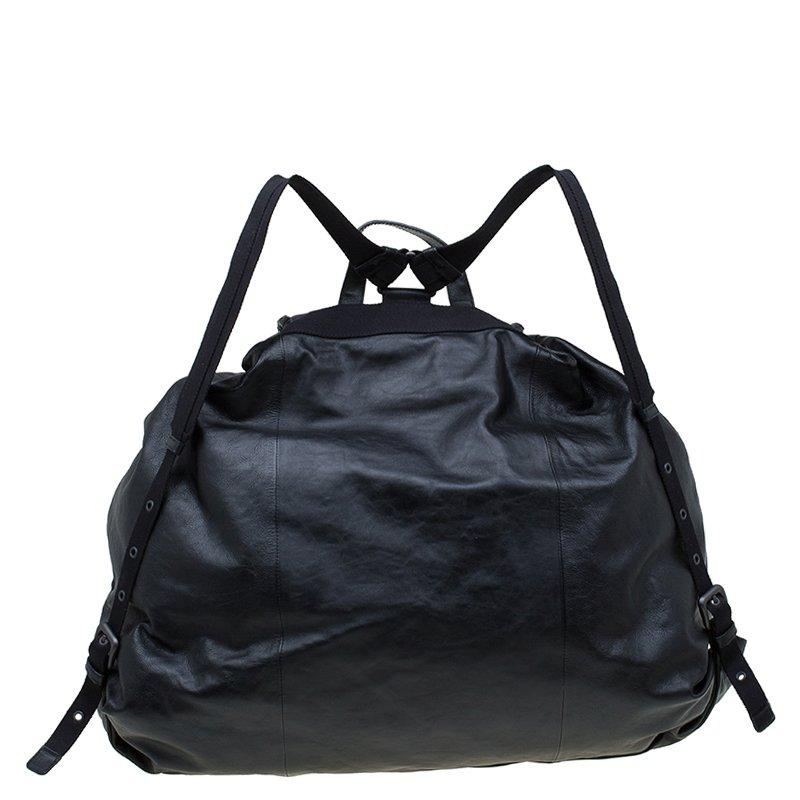 High on internal functionality, this simple yet stylish black leather backpack supporting adjustable drawstrings, a flap and buckle closure is sure to stand the test of time. Its two adjustable shoulder straps let you carry the bag comfortably
