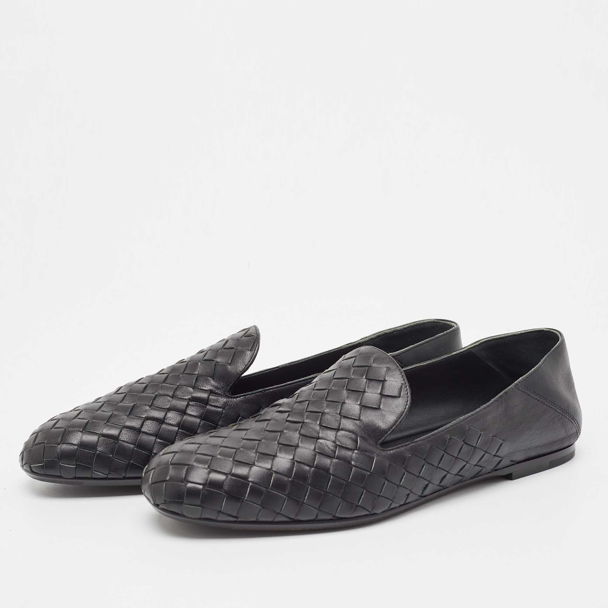 This pair of loafers by Bottega Veneta is so comfy, you'll love putting them on wherever you go. The exterior of the pair has been crafted from black leather in their signature Intrecciato weave pattern. They are stylish and easy to slip on.

