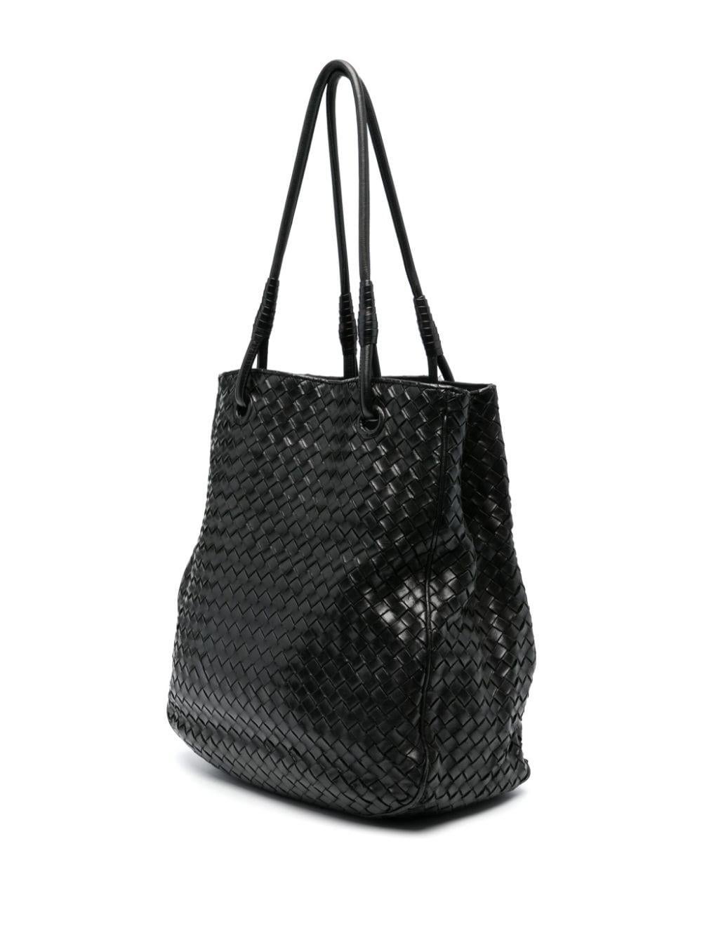 Bottega Veneta black leather Intrecciato open-top tote bag featuring iconic Intrecciato design, two rolled top handles, internal zip-fastening pockets, leather lining, internal logo plaque. 
Circa: 2000s
Length: 12.6in. (32cm) 
Height: 12.2in.