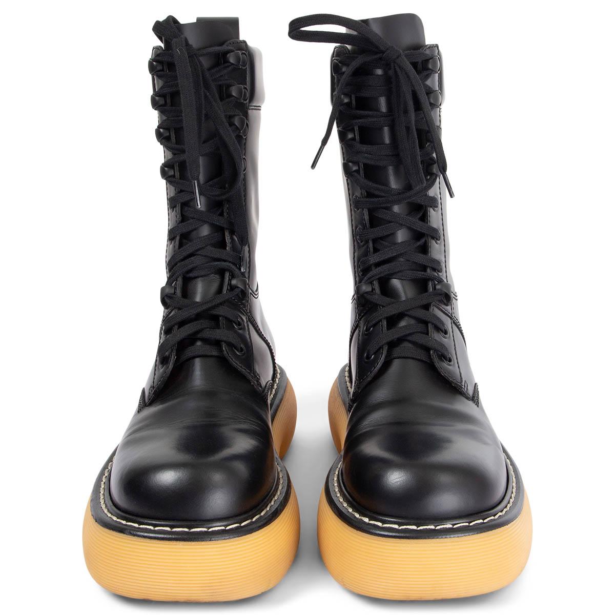 100% authentic Bottega Veneta The Bounce lace-up combat boots in black calfskin with contrasting yellow tread sole. Have been worn and are in excellent condition. Come with dust bags.

Measurements
Imprinted Size	38.5
Shoe Size	38.5
Inside
