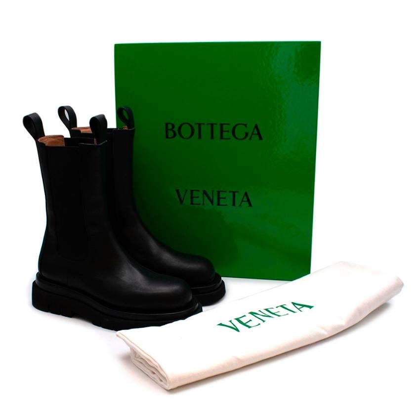 Bottega Veneta Black Leather The Lug Boots

Mid-calf boots with a stacked lug sole

- Vegetable tanned calfskin
- Elasticated side panels and leather tabs
- Cut slim on the ankle
- Lightweight layered cuoio and rubber sole
- Soft leather lining 
-