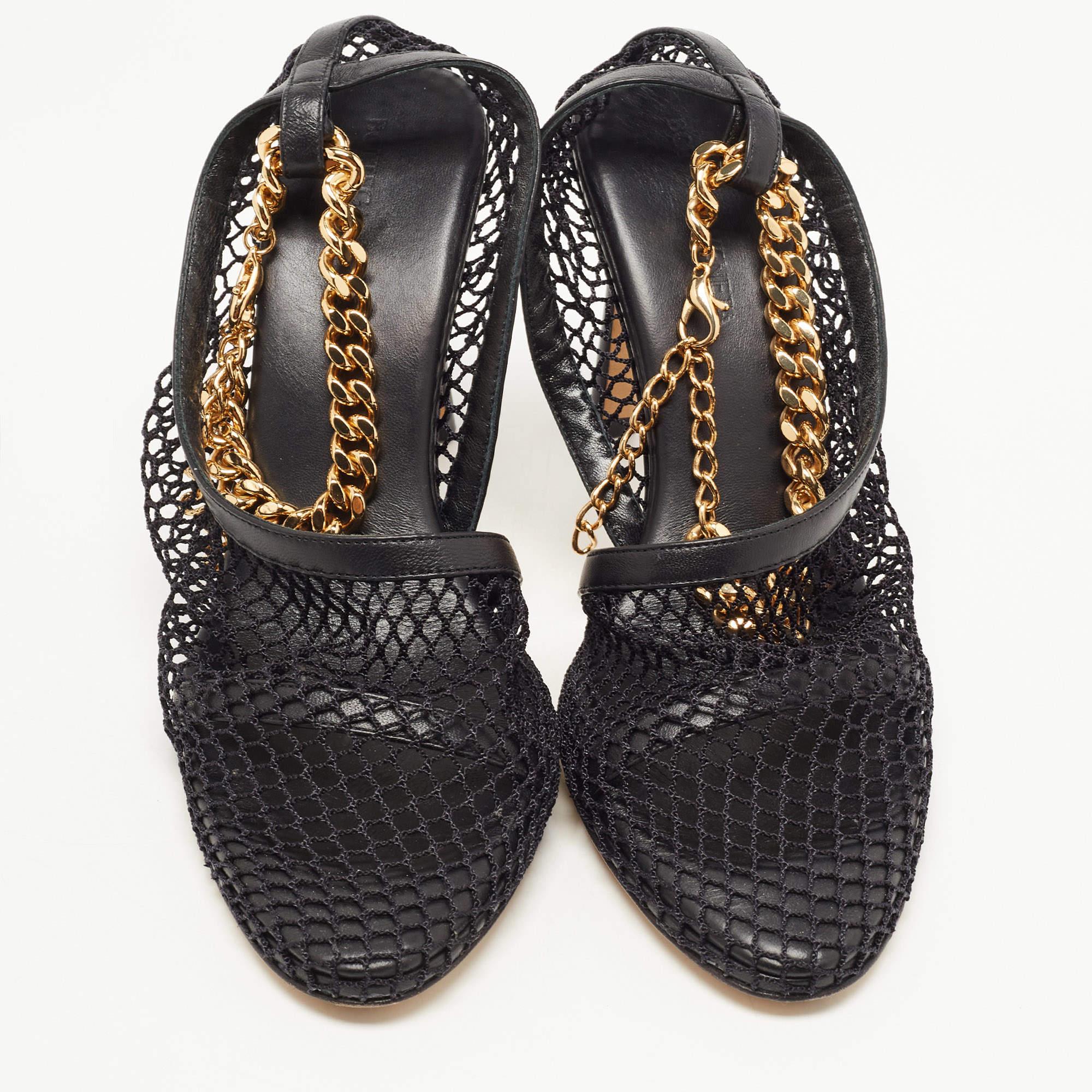 The BV sandals are a stylish and edgy footwear choice. These avant-garde sandals feature a combination of black mesh and leather materials, with chunky chain detail on the ankle strap, adding a touch of sophistication. They offer both comfort and a