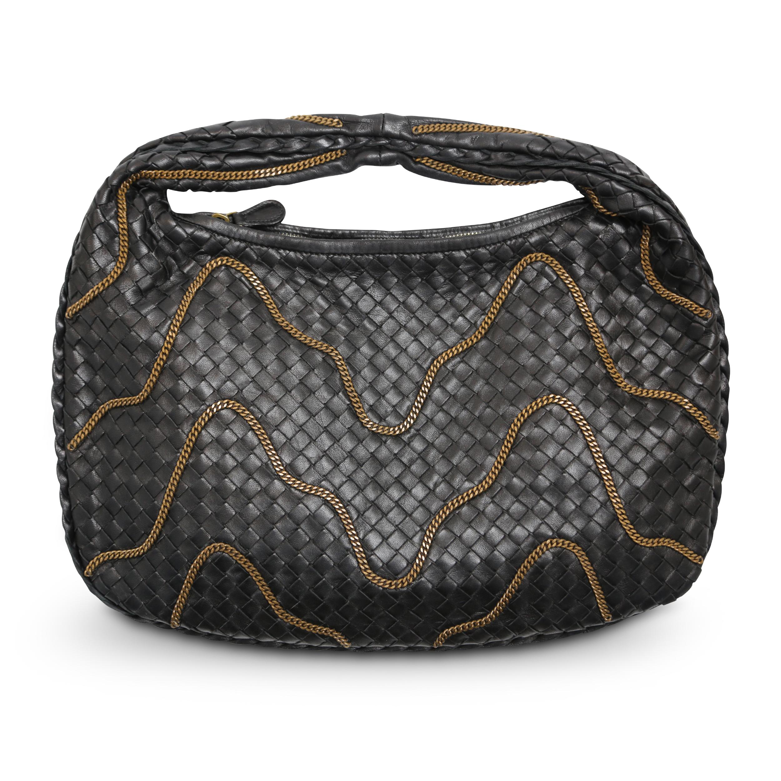 Experience modern luxury with Bottega Veneta's Signature Intrecciato Woven Leather Bag. Crafted in classic dark brown and adorned with antique brass wavy chain embroidery, this bag is a timeless statement piece. Please kindly note that this bag has