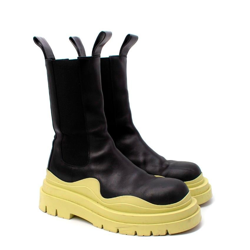 Bottega Veneta Black & Neon Green Tire Leather Boots
 

 - Exaggerated chelsea boot shape given a modern makeover with a bright neon greeny-yellow rubber sole
 - Tonal elasticated side
 - Pull-on style 
 

 Materials:
 Leather
 Rubber 
 

 PLEASE