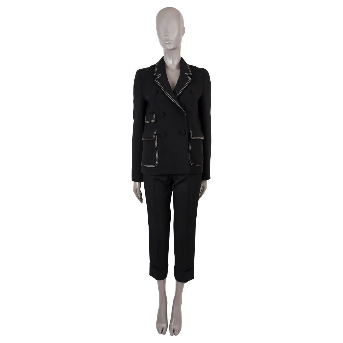 100% authentic Bottega Veneta double breasted blazer in black wool (78%), polyamide (18%) and elastane (4%). Features contrasting white top stitching and three flap pockets. Closes with fabric covered buttons. Lined in viscose (100%). Has been worn