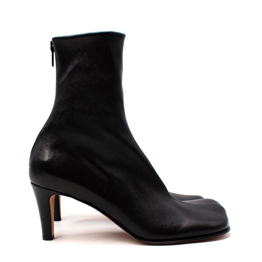 Bottega Veneta Bloc Black Leather Square Toe Ankle Boots
 

 - Smooth supple black leather ankle boots, fitting closely around the ankle, with a squared off toe, synonymous with Daniel Lee's vision for the House
 -Back zip closure 
 

 Materials 
