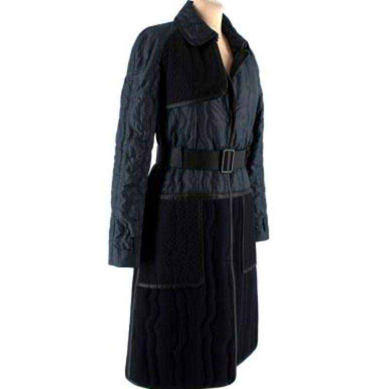 Bottega Veneta Blue Black Belt Coat

- Quilted body
- Long sleeved
- Thin and lightweight 
- Button fastening
- Adjustable belt fastening
- Leather detailing
- Small rear vent

Material
Fabric 1: 100% Polyamide
Fabric 2: 84% Cotton and 16%