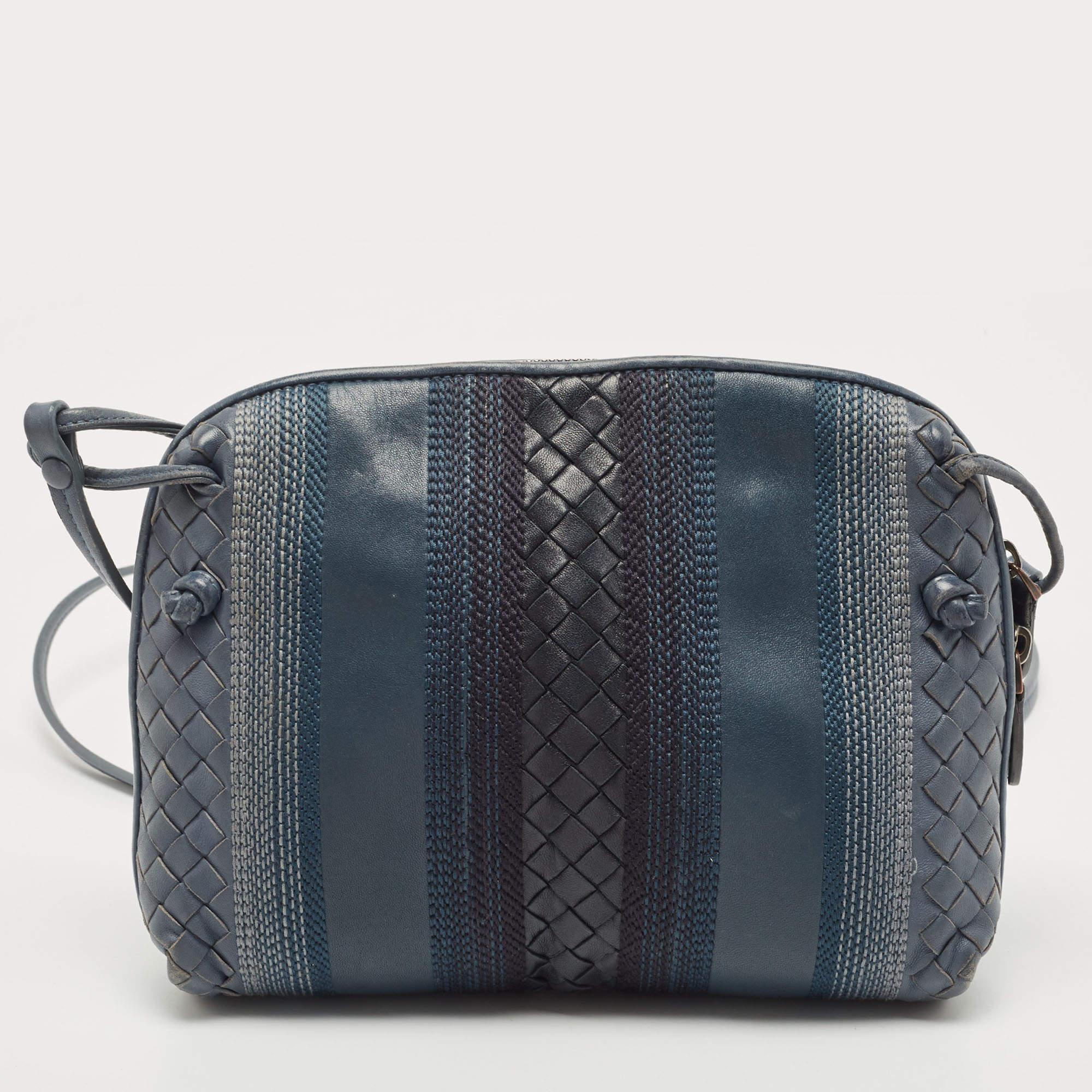 Structured, sophisticated, and stylish are some words that describe this crossbody bag! Crafted from best quality material, the creation is adorned with the label's signature appeal, held by comfortable handles, and equipped with a well-spaced