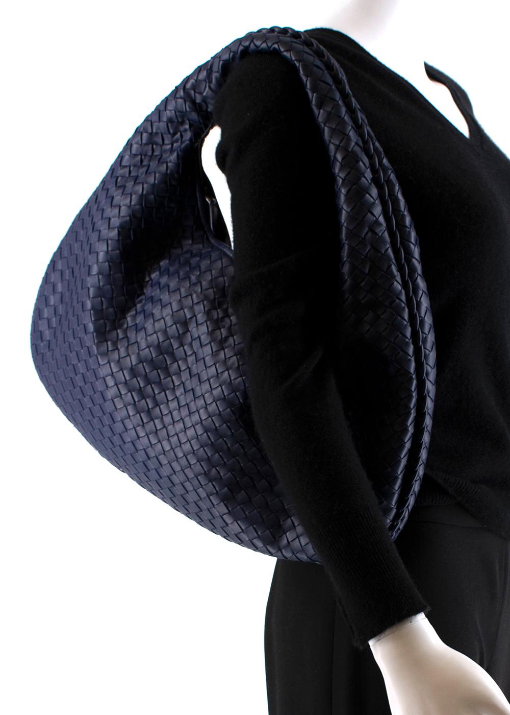 Bottega Veneta Blue Intrecciato Medium Veneta Hobo Bag

Rounded hobo bag in woven leather 
- Woven by hand with a curved, seamless structure 
- Iconic intrecciato 15 weave 
- Zip fastening  
- Soft velvet like Calf suede lined interior with a zipped
