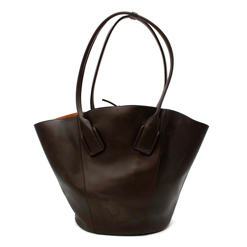 Bottega Veneta Brown Basket Large Leather Tote Bag
 

 - Bottega Veneta's large dark Basket tote bag features butter-soft leather in a deep chocolate brown hue
 - A capacious main compartment lined in tobacco coloured suede with a detachable pouch