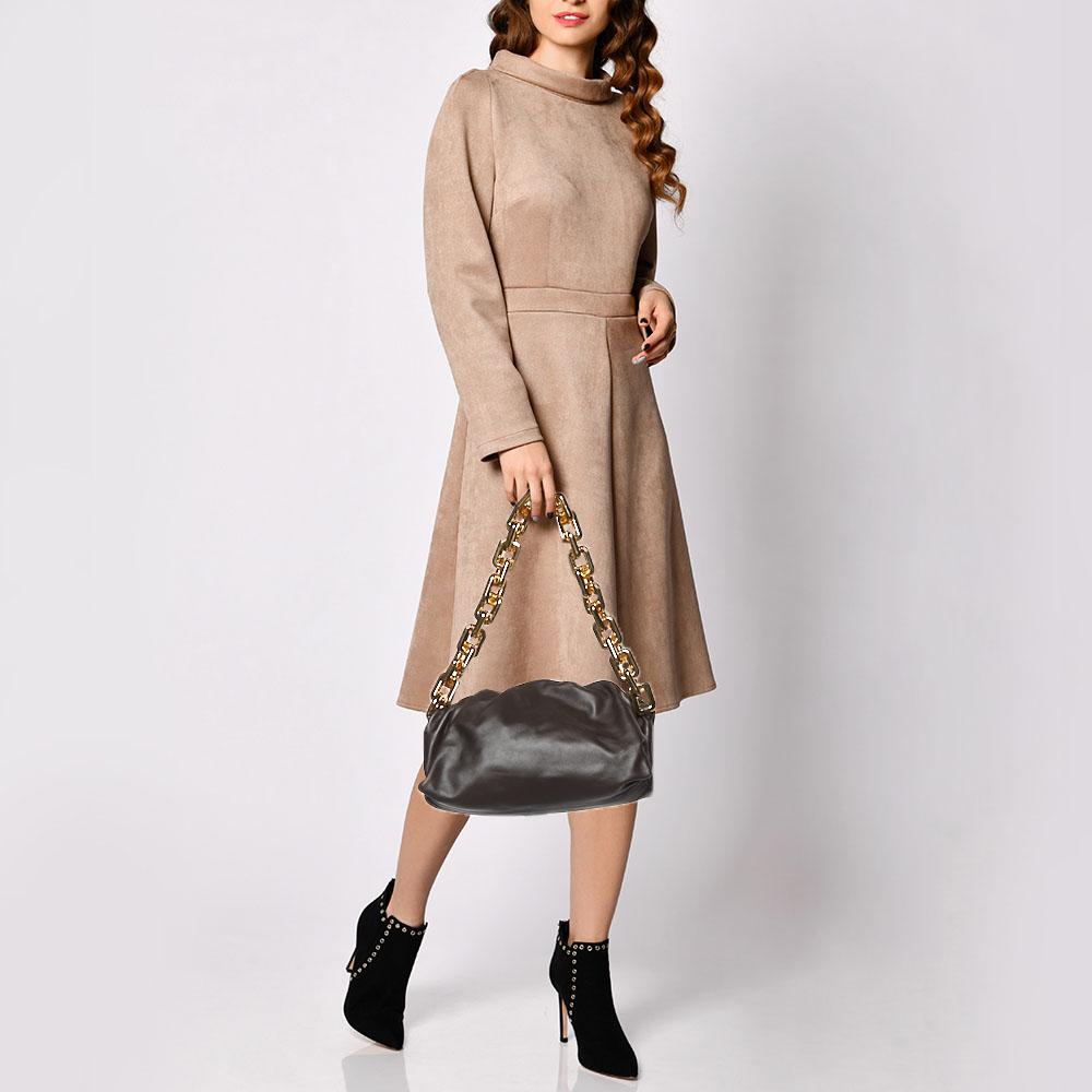 A bag that took the fashion world by storm, Bottega Venetaâ€™s The Pouch reflects previous creative director Daniel Leeâ€™s distinctive style choices. This version is skillfully crafted from brown leather into its signature unstructured silhouette