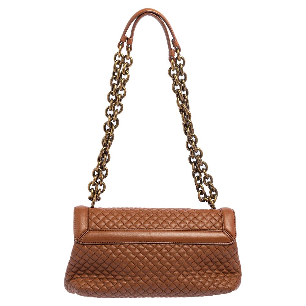One look at this Olimpia shoulder bag from Bottega Veneta and you'll be smitten by its exotic appeal. It is high in style and exudes sophistication. It is crafted from brown leather using a quilting technique that mimics the signature Intrecciato