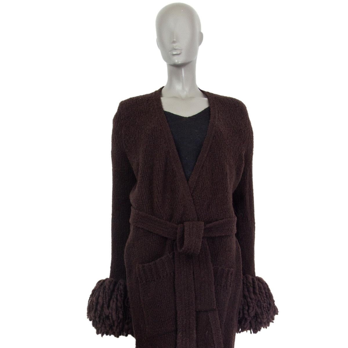 Bottega Veneta belted long cardigan. It is designed to complete the season’s luxe loungewear sensibility. Made of espresso brown soft wool (88%) and polyamide (12%) with fringed mohair trim at the cuffs, the soft knit works beautifully with an