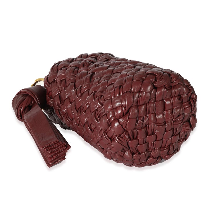 Listing Title: Bottega Veneta Burgundy Intreccio Leather Kalimero Bucket
 SKU: 128472
 MSRP: 7500.00
 Condition: Pre-owned 
 Handbag Condition: Excellent
 Condition Comments: Excellent Condition. Exterior faint scuffing. Interior scuffing