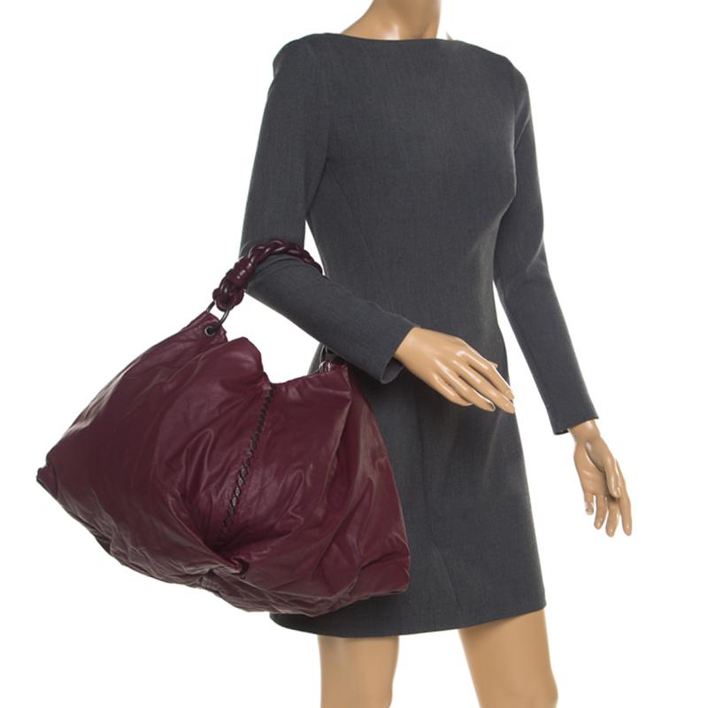 Comfortable and fabulously stylish is what this leather hobo has to offer. With a suede interior, this bag is highly functional. Designed beautifully, this bag comes in a burgundy shade and is held by a braided top handle.

Includes: The Luxury