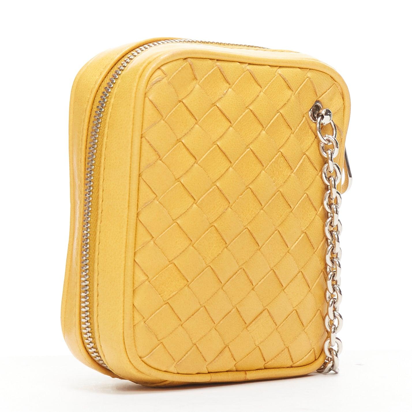 BOTTEGA VENETA butter yellow intrecciato woven silver chain wrist pouch bag
Reference: AAWC/A00991
Brand: Bottega Veneta
Material: Leather
Color: Yellow, Silver
Pattern: Solid
Closure: Zip
Lining: Nude Fabric
Made in: Italy

CONDITION:
Condition: