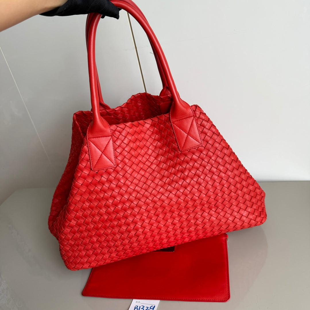 Bottega Veneta Cabat Large Intreccio Red Leather 40cm
 These are professional photos of the actual bag offered by Luxbags.
 Discover the sophisticated luxury of the Bottega Veneta Cabat Intreccio Leather Tote Bag. Revel in its stylish cult design,