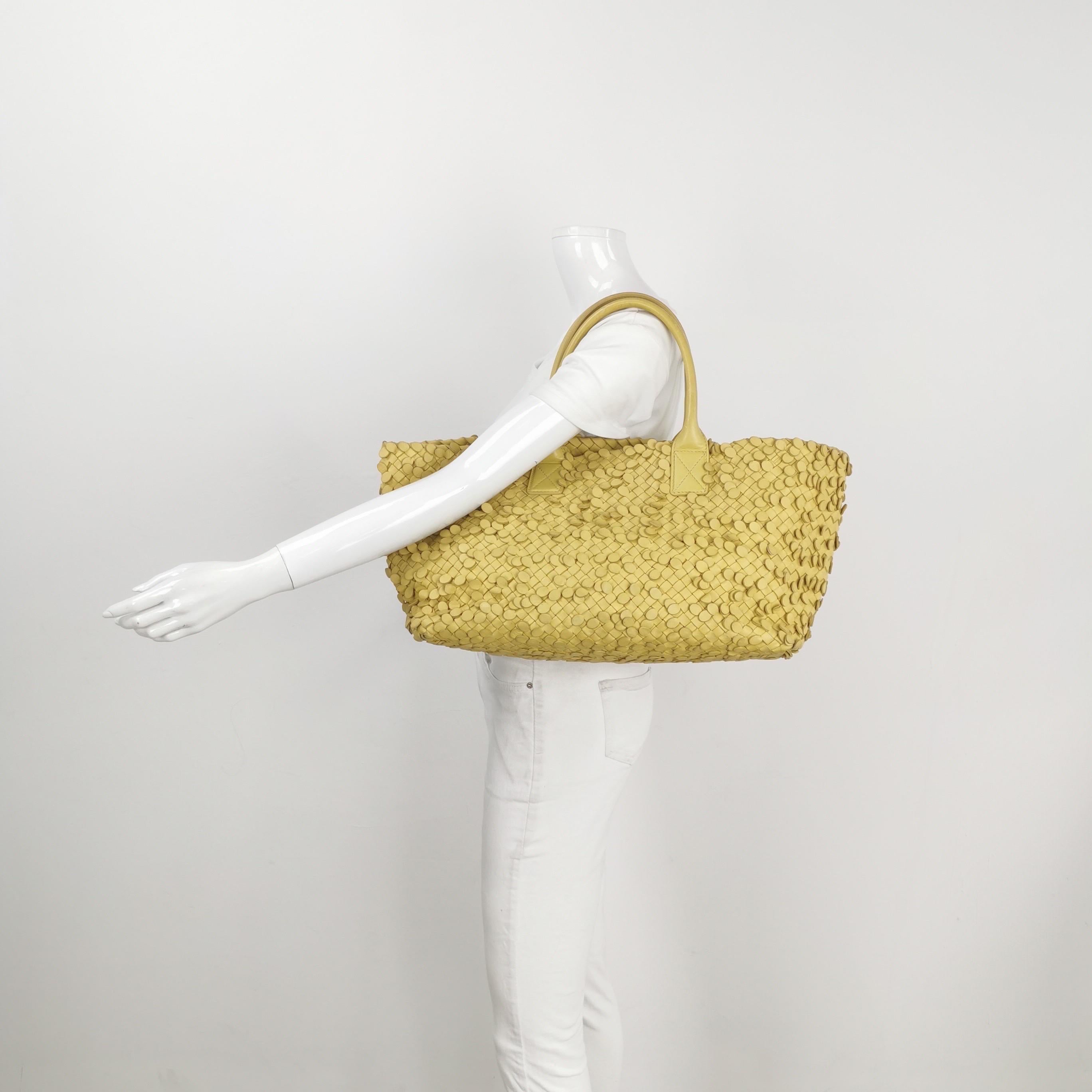 Bottega Veneta Cabat Limited Poussin Paillettes Tote yellow
 These are professional photos of the actual bag offered by Luxbags.
 Discover the sophisticated luxury of the Bottega Veneta Cabat Intreccio Leather Tote Bag. Revel in its stylish cult