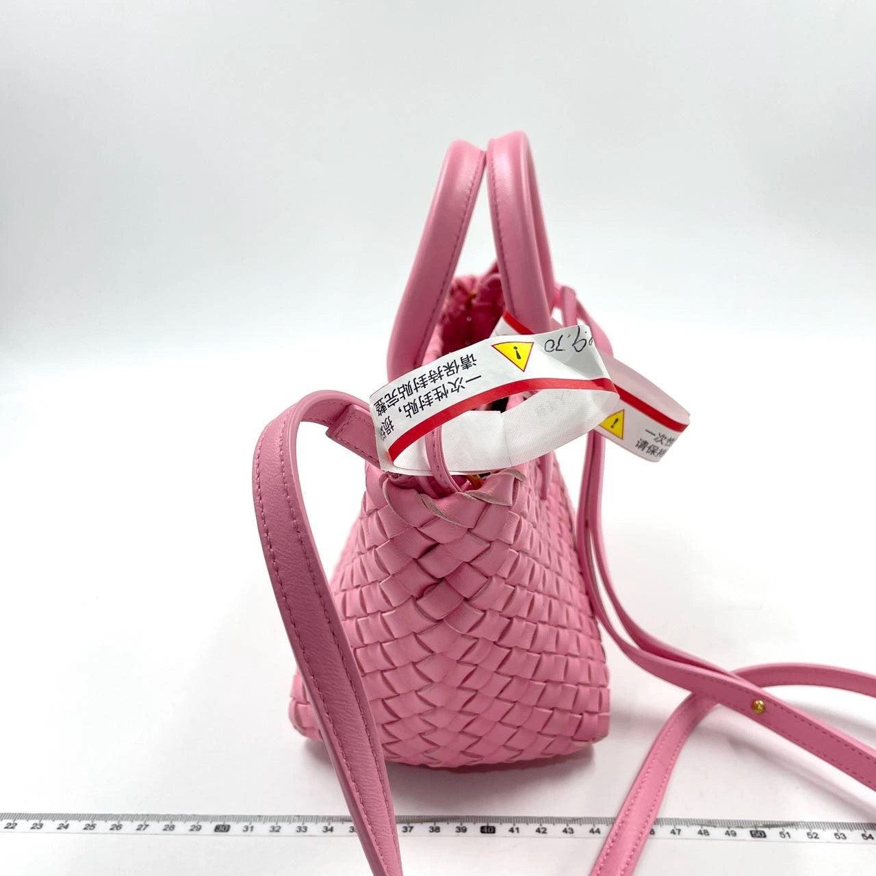 Bottega Veneta Cabat Mini Intreccio Leather Tote Bag Pink
 These are professional photos of the actual bag offered by Luxbags.
 Discover the sophisticated luxury of the Bottega Veneta Cabat Intreccio Leather Tote Bag. Revel in its stylish cult