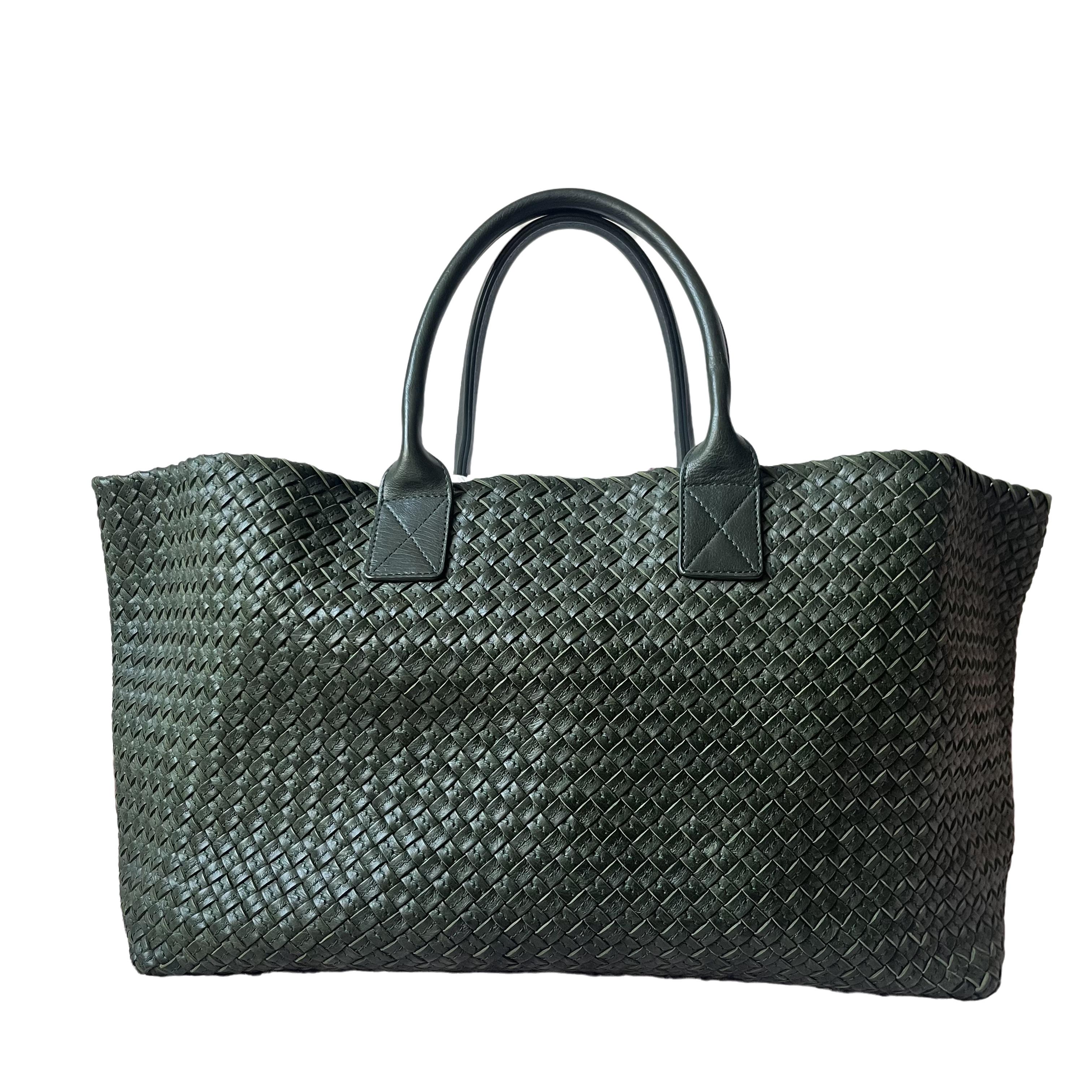 Discover the sophisticated luxury of the Bottega Veneta Cabat Intreccio Leather Tote Bag. Revel in its stylish cult design, handcrafted in a luxurious calfskin leather with the signature intreccio weave. 

Take each Bottega Veneta artisan 2 entires