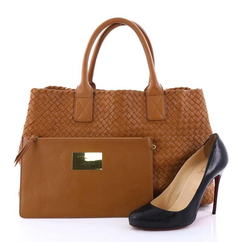 This authentic Bottega Veneta Cabat Tote Intrecciato Nappa Medium is a statement piece you can surely take from day to night. Beautifully crafted in brown nappa leather in Bottega Veneta's signature intrecciato woven method, this oversized stylish