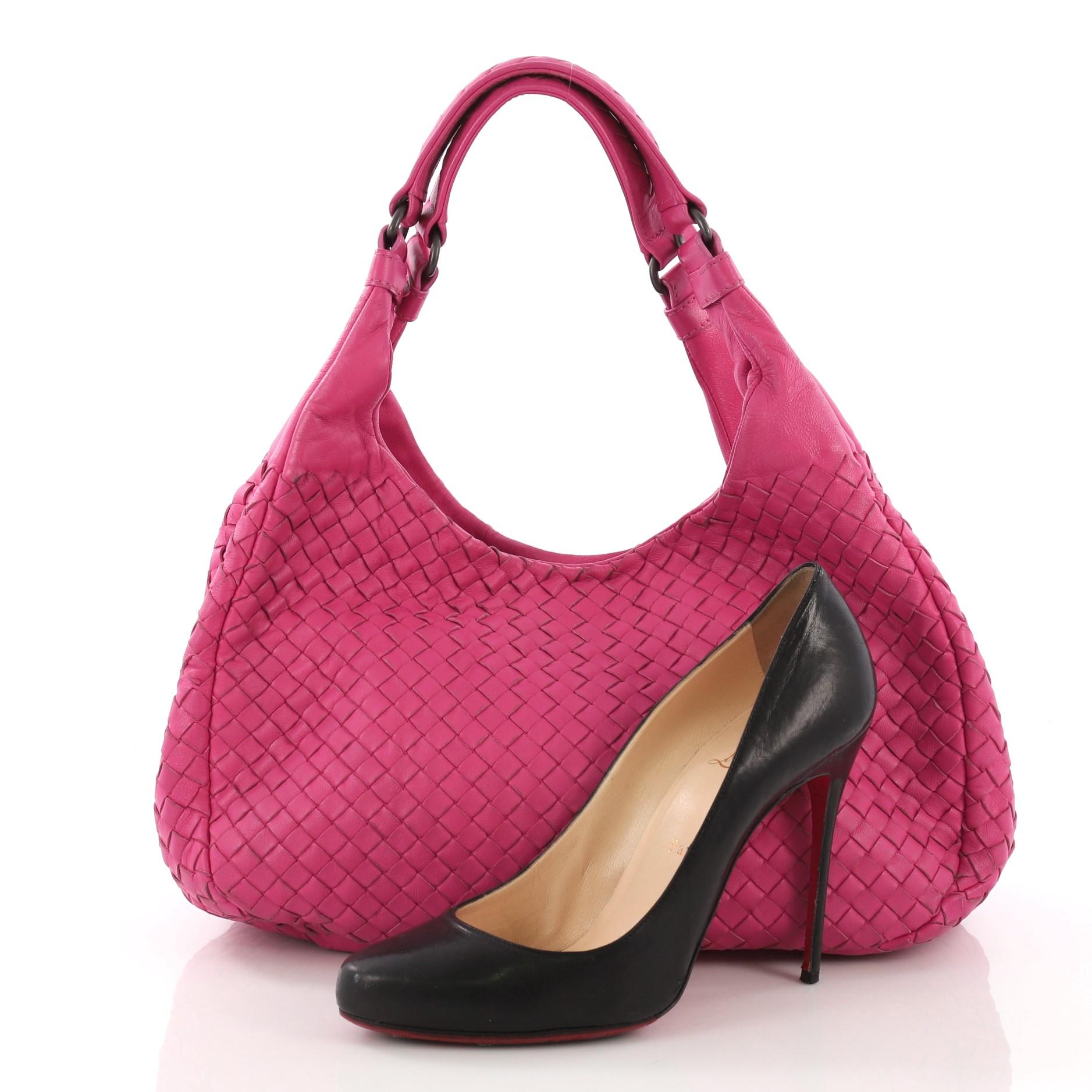 This Bottega Veneta Campana Hobo Intrecciato Nappa Small, crafted in pink intrecciato nappa leather, features dual shoulder straps and matte gunmetal-tone hardware. Its hidden magnetic snap closure opens to a brown suede interior with slip and zip