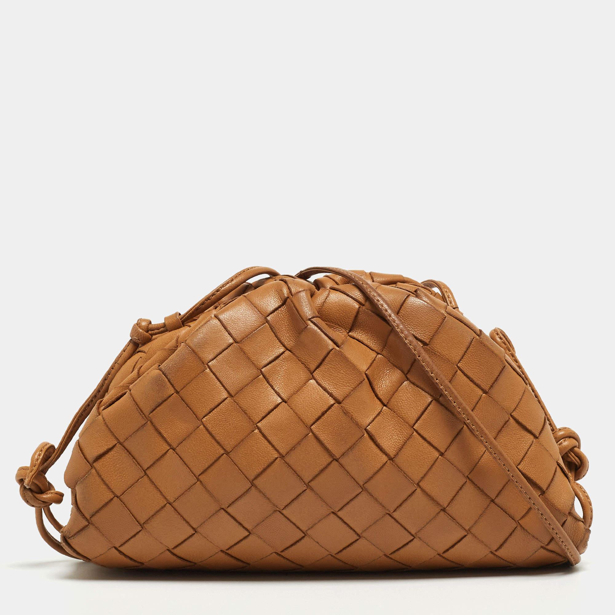 Elevate your style with this Bottega Veneta bag. Merging form and function, this exquisite accessory epitomizes sophistication, ensuring you stand out with elegance and practicality by your side.

