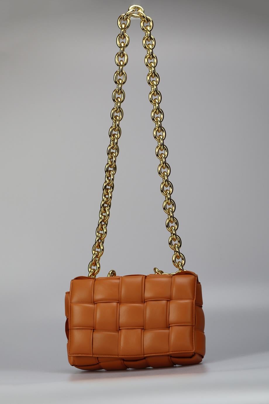 Bottega Veneta Cassette Chain Detailed Intrecciato Leather Shoulder Bag. Tan. Lock fastening - Front. Comes with - dustbag. Height: 7.3 In. Width: 10.6 In. Depth: 2.7 In. Handle drop: 4.5 In. Strap drop: 19.5 In. Condition: Used. Very good condition