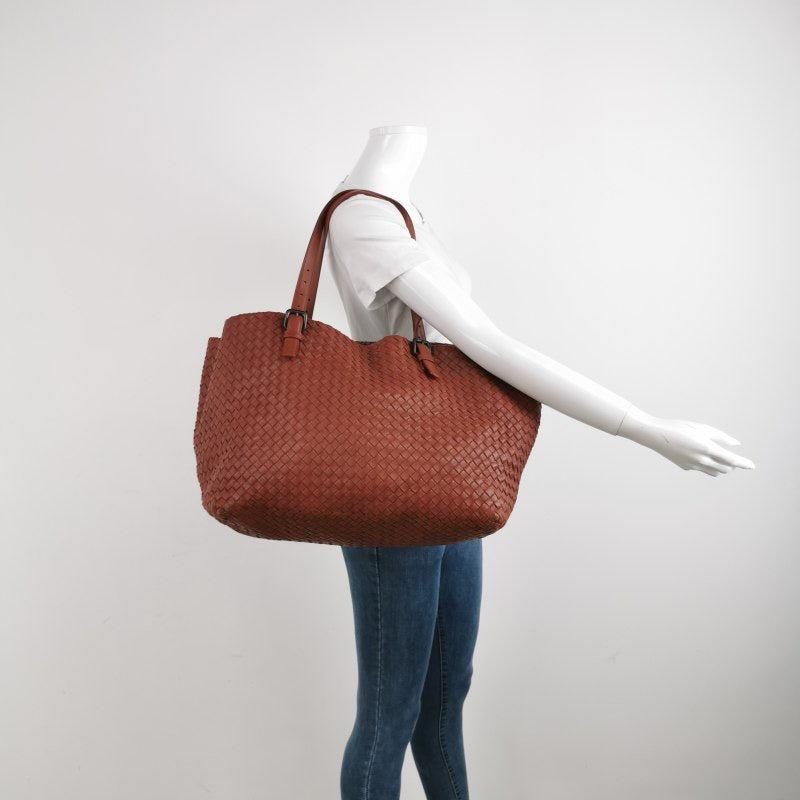 Bottega Veneta Cesta Tote Nappa Intrecciato Leather Brick Red 37cm
 These are professional photos of the actual bag.
 CONDITION: EXCELLENT
 Some crease lines. Exterior and interior clean.
 DETAILS: 
 
 Bottega Veneta
 Veneta
 
 Color: Brick Red
