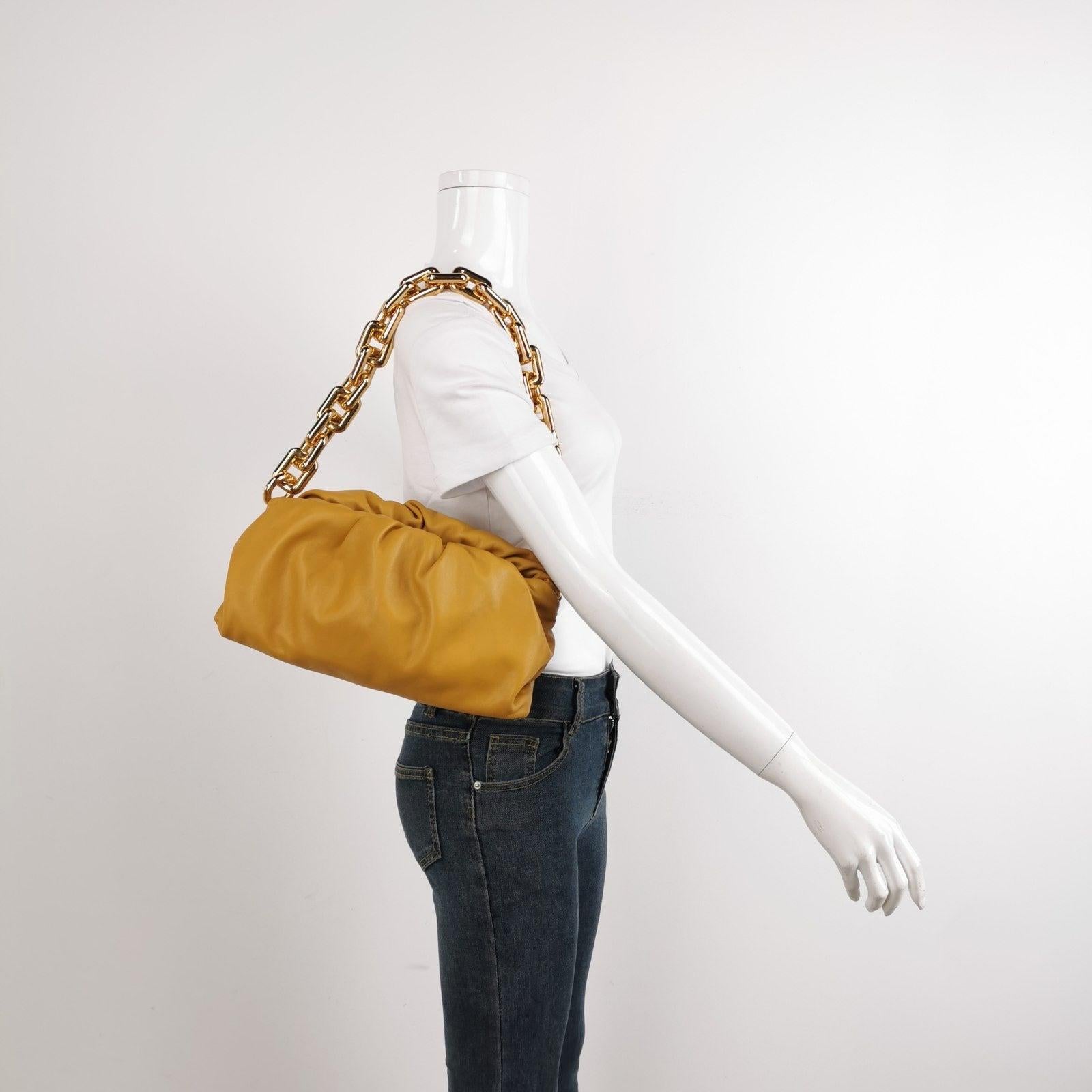 Bottega Veneta Chain Pouch Calfskin Leather Caramel Brown Large These are professional photos of the actual bag offered by Luxbags. This Bottega Veneta Pouch stands out brilliantly, with its caramel colour on luxurious calfskin leather. On the