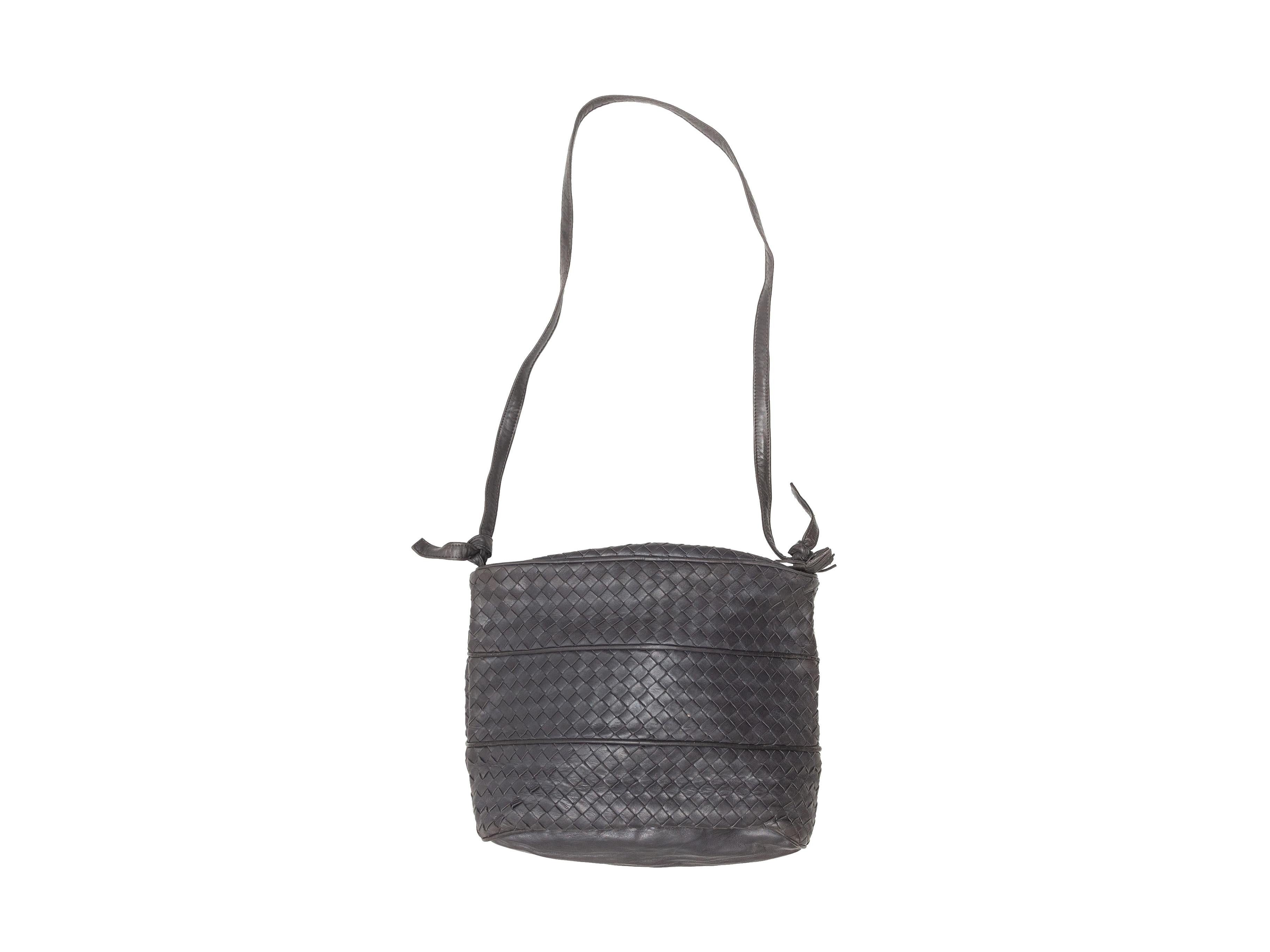 Product details: Vintage charcoal Intrecciato leather shoulder bag by Bottega Veneta. Zip closure at top. 12.5