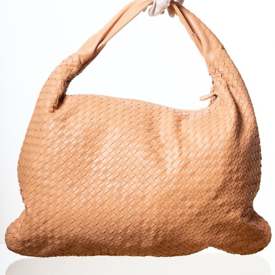Bottega intrecciato-woven nappa lambskin hobo shoulder bag in nude/blush color featuring a fixed shoulder strap, zip closure, beige microfiber interior with zip and patch pockets.

COLOR: Nude/blush
MATERIAL: Lambskin leather
ITEM CODE:
