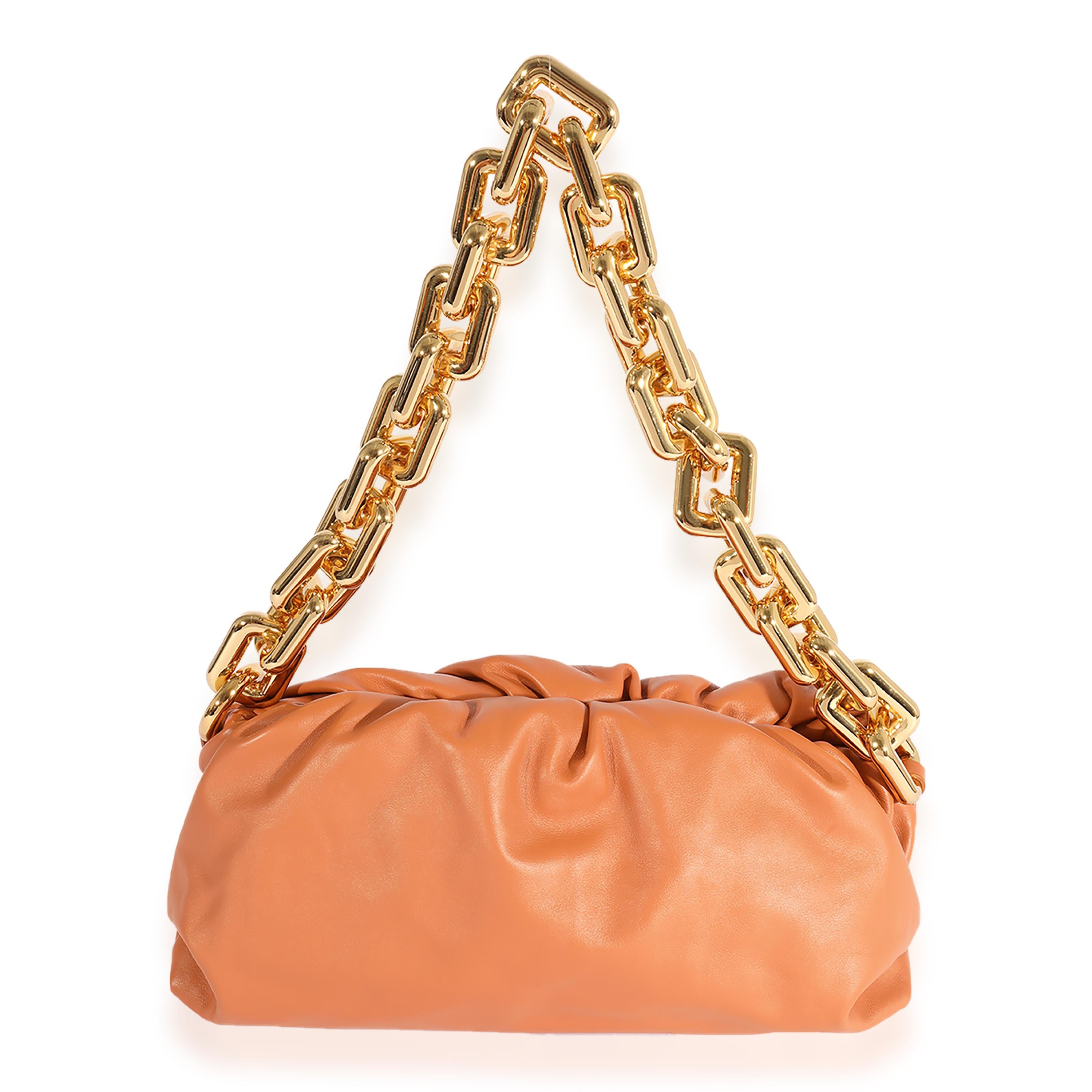 Listing Title: Bottega Veneta Clay Calfskin Chain Pouch
SKU: 123398
MSRP: 4100.00
Condition: Pre-owned 
Handbag Condition: Excellent
Condition Comments: Excellent Condition. Faint interior scuffing. No other visible signs of wear.
Brand: Bottega