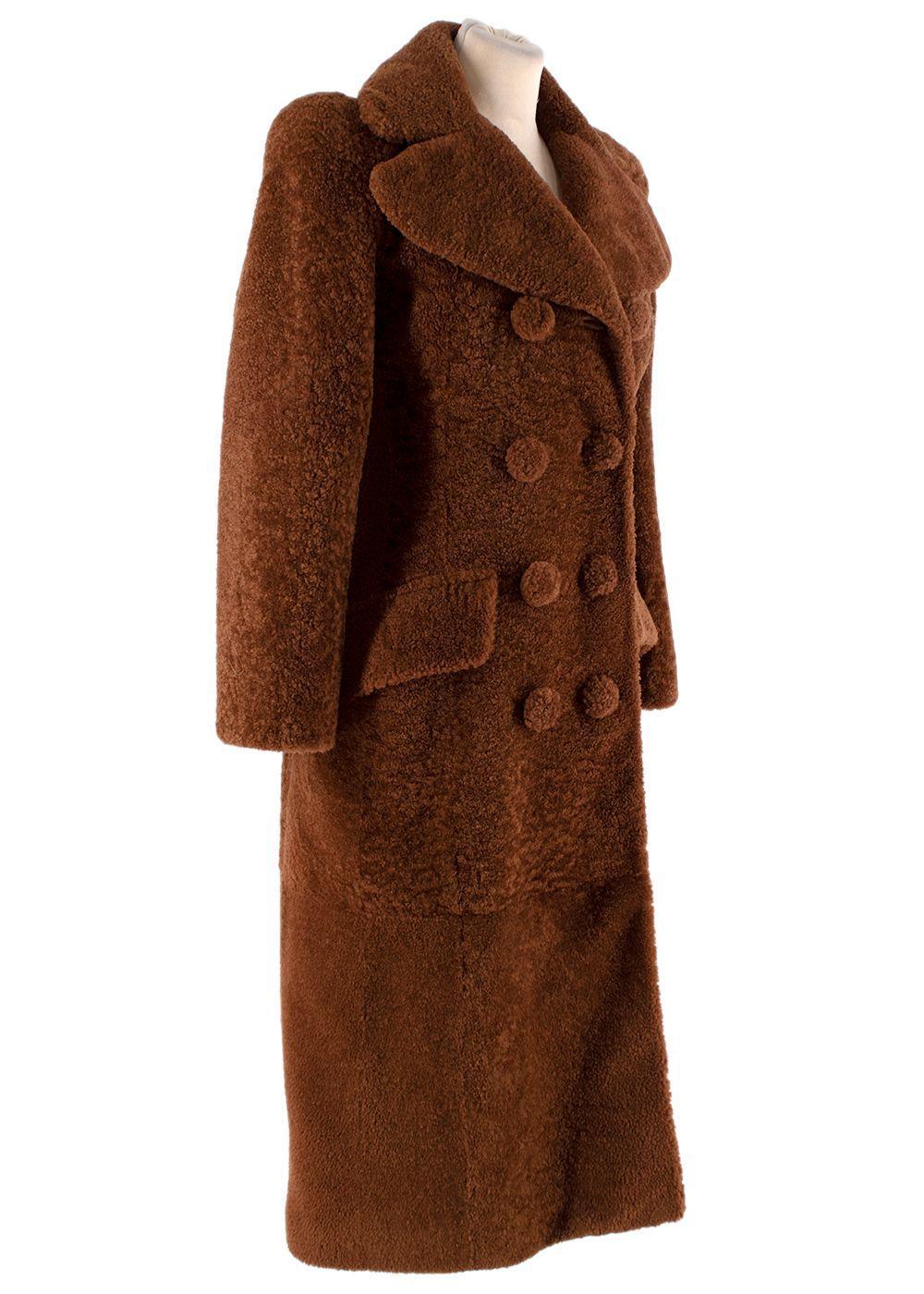 Bottega Veneta Cognac-brown Shearling Teddy Coat

- Longline, teddy-style coat in a rich cognac-brown hue
- Retro-inspired silhouette with exaggerated notched lapel, and double-breasted front
- Large, tonal buttons
- 2 flapped hip pockets
- Fully