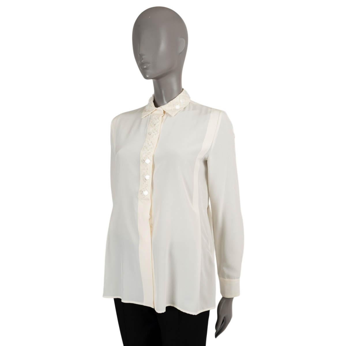 100% authentic Bottega Veneta semi-sheer blouse in cream silk (100%). Features a quilted collar encrusted with clear rhinestones with square beads on top. Opens with concealed buttons on the front. Has been worn and is in excellent condition.