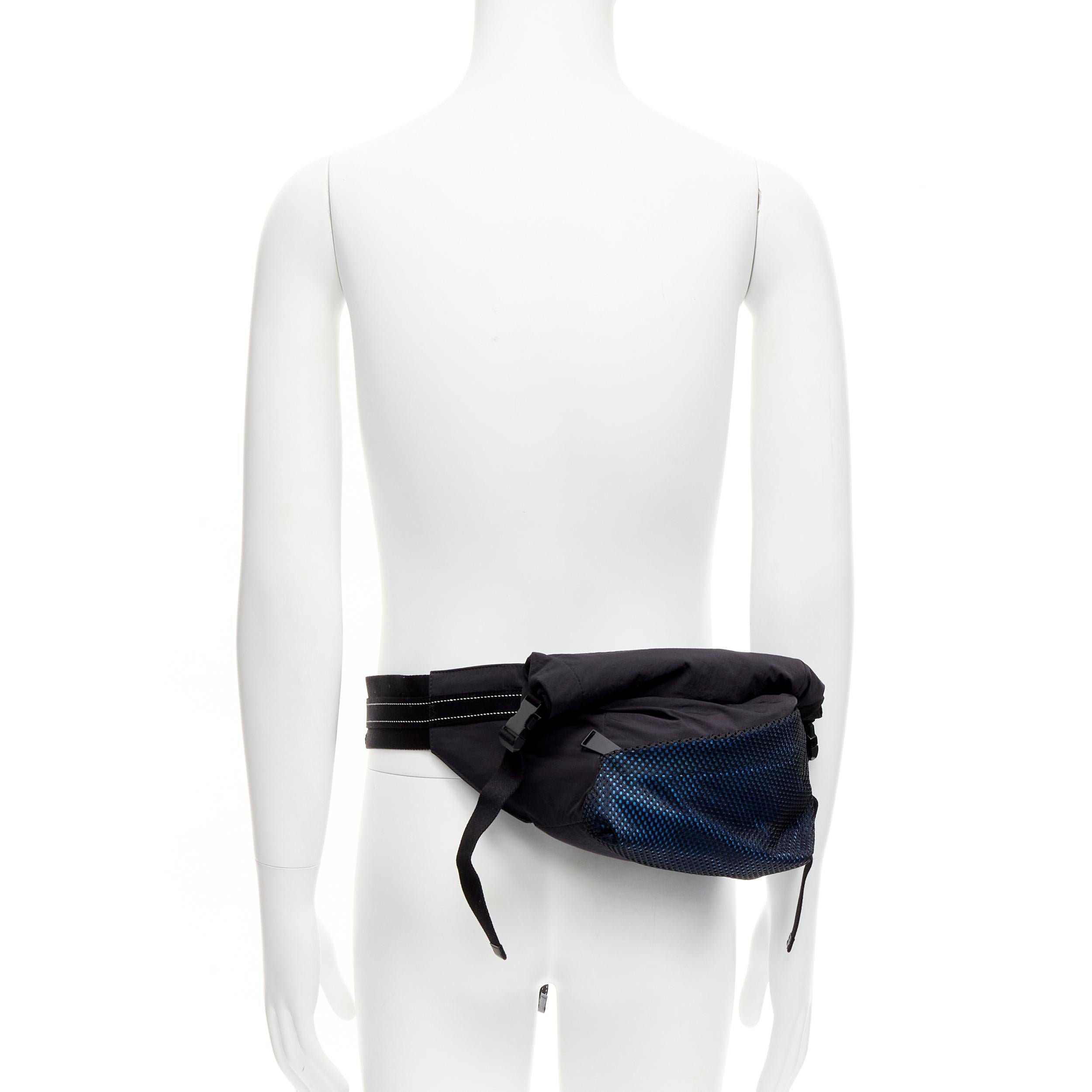BOTTEGA VENETA Daniel Lee blue black nylon mesh technical buckle waist belt bag
Reference: CRTI/A00759
Brand: Bottega Veneta
Designer: Daniel Lee
Material: Nylon
Color: Black, Blue
Pattern: Solid
Closure: Buckle
Lining: Blue Fabric
Extra Details: BV