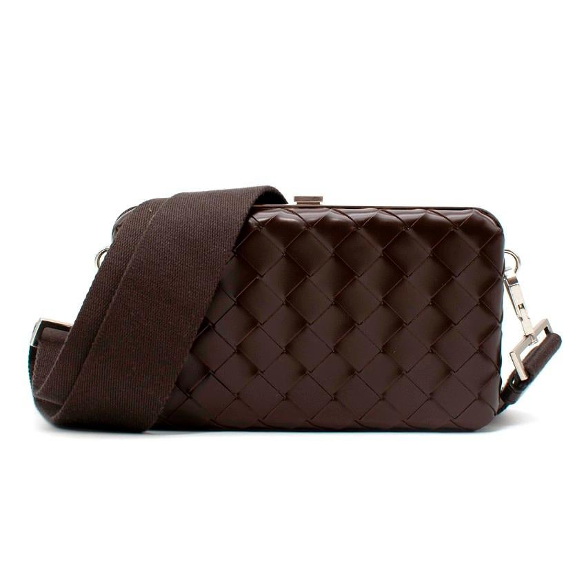 Bottega Veneta Dark Brown Intrecciato Leather Hardcase Crossbody Bag
 

 - Dark brown Intrecciato woven leather 
 - Silver-tone frame with a clasp closure
 - Interior lined with tonal smooth leather and one slip pocket
 - Removable, adjustable strap