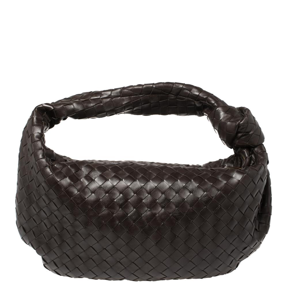Daniel Lee's creative directorship at Bottega Veneta has made the house's iconic intrecciato technique even more covetable. Displaying his penchant for craftsmanship beautifully, this brown Jodie hobo bag has been woven in Italy from leather. It has