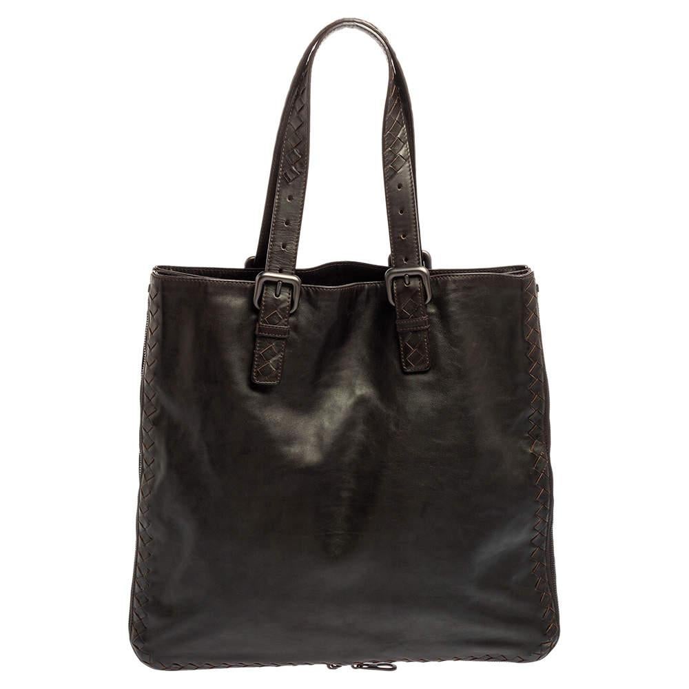 Coming from the House of Bottega Veneta, this tote will surely be your favorite handbag in no time. It is made from dark-brown leather and features Intrecciato leather trims. It is provided with an expandable detail and comes with dual handles.