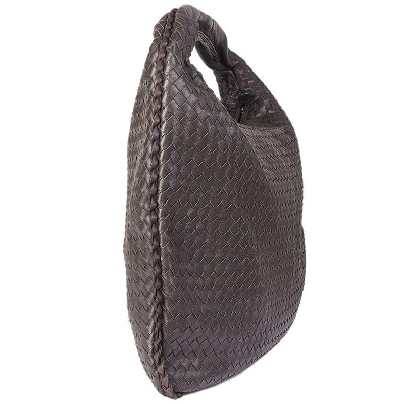 Bottega Veneta 'Veneta Large' hobo in dark brown Intrecciato leather. Closes with a zipper on top. Lined in beige suede with an open pocket against the front and a zipper pocket against the back. Has been carried and is in excellent condition. Comes