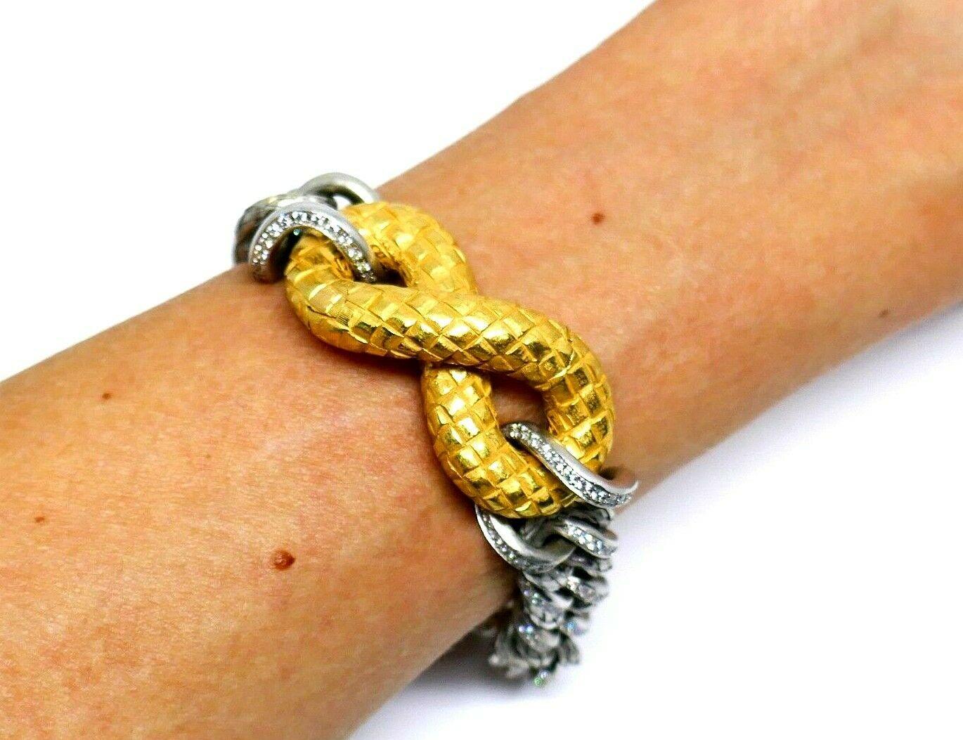 Rare Bottega Veneta Torcello bracelet made of 18k white gold featuring pave diamonds and 18k yellow gold clasp. The clasp has an invisible closure. Gold is hammered and textured. Stamped with the Bottega Veneta maker's mark and a hallmark for 18k