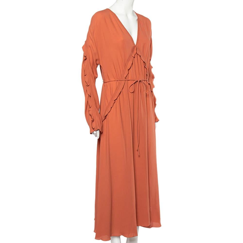 Designed by the House of Bottega Veneta, this chic ensemble is certainly a wardrobe essential. This fluid maxi dress is draped beautifully with dusky-orange silk georgette, making it a perfect summer choice and holiday solution. A stunning V-shaped