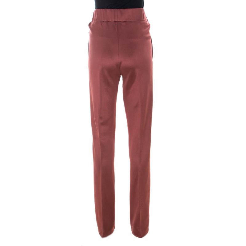 To give you comfort and high style, Bottega Veneta brings you this dusky pink creation that has been made from quality fabrics and designed with an elasticized waist. This pair of pants will surely be a delighting buy.

